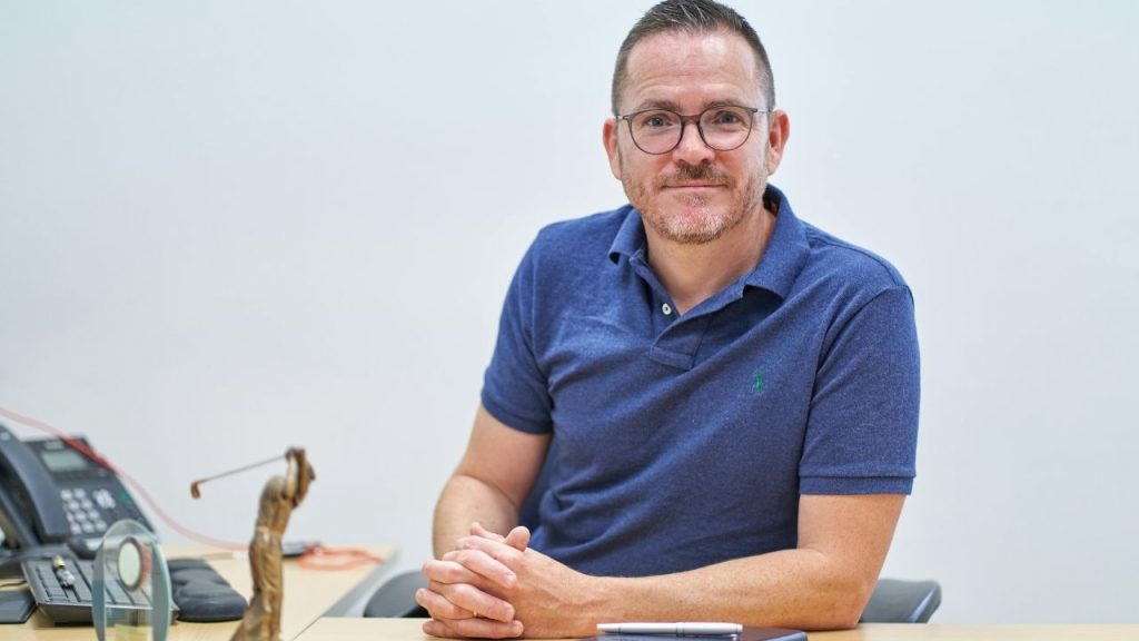A professional headshot of Richard Keeler